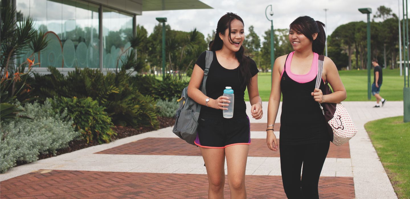 Campus two females walking
