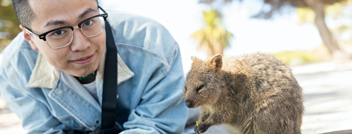 Off campus male with wallaby