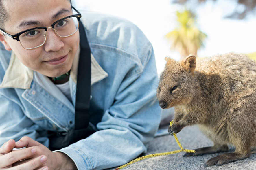 Off campus male with wallaby